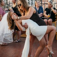 Women dancing and laugh on their hen party